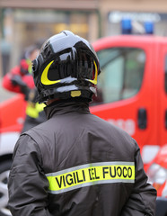 firefighter with protective helmet and the word VIGILI DEL FUOCO