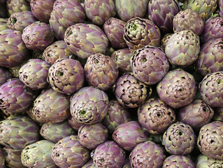 Fototapeta premium green background of artichokes for sale in Italian market