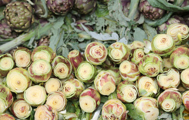 clean bottoms of artichokes prepared by the cook in the water