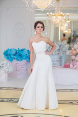 Fototapeta premium young beautiful bride with make-up and styling