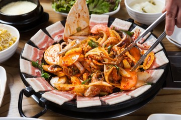  jukkumi with samgyeopsal, sewu, ojingeo.  Stir-fried Small Octopus with pork belly, shrimp, squid