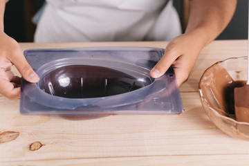 Close up of Brazilian woman making homemade Easter eggs