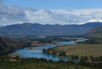 Turquoise river meandering its way through the stunning mountains.