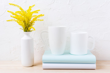 Two white coffee and cappuccino mug mockup with ornamental grass