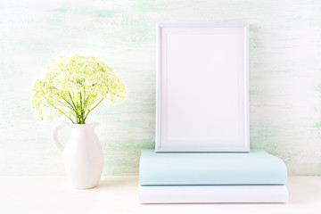 White frame mockup with pale mint book
