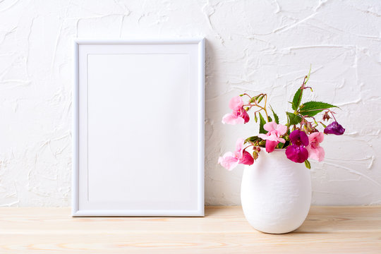 White frame mockup with pink house plants in flowerpot