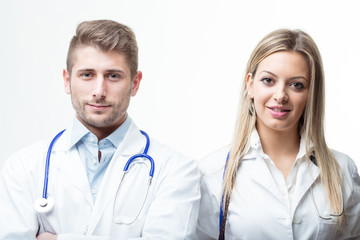 Doctors with stethoscope around their neck smiling at the camera