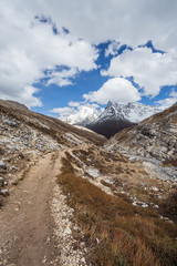 Mountain trail in Yading-China. Path along the ridge leading to summit