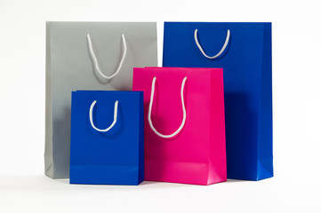 Multicolored paper shopping bag isolated on white