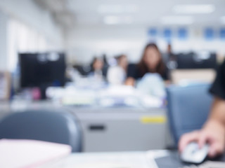 office blurred background with people working at desk