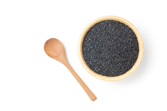 Black sesame seeds in wooden bowl with spoon