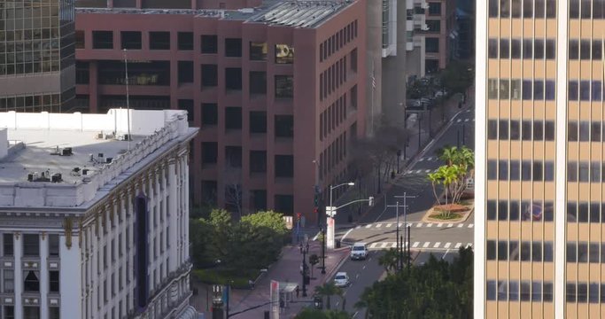 A high-angle view of light morning traffic on Broadway in downtown San Diego.  	