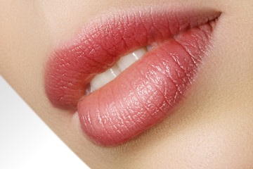 Closeup perfect natural lip makeup. Beautiful plump full lips on female face. Clean skin, fresh make-up. Spa tender lips