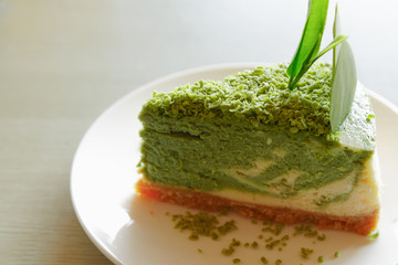 Green tea cake on write dish