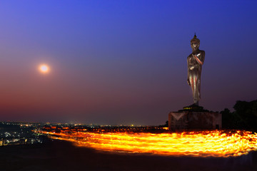 fire wark and candle for buddhism ceremony with buddha statue, watkhaophrakru, criracha, chonburi, Thailand,