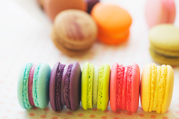 Tasty french macarons on a table with vintage color tone, Macarons is a French sweet meringue-based