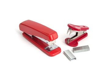  Red Stapler with staples wires and stapler remover on white background.   