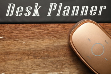 The loudspeaker put on brown color hardwood surface represent the speaker sound device and service...