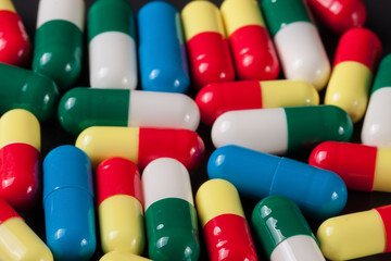 colorful pills on a dark background