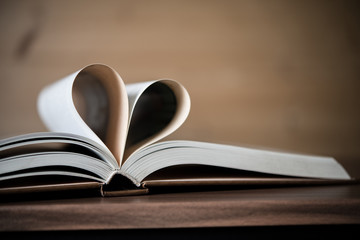 Pages of a book forming the shape of the heart. Love concept.