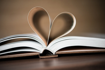 Pages of a book forming the shape of the heart. Love concept.