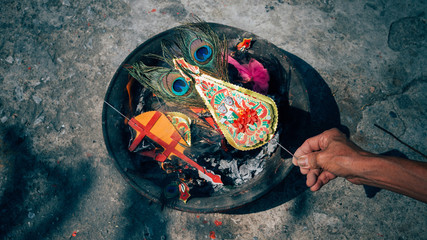 The Feather Peacock with incense burner in Chinese culture..Chinese traditional burn paper, joss paper, sheets of paper that are burned in traditional Chinese deity or ancestor worship ceremonies