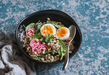 Healthy diet food - salad with quinoa, spinach, beets and boiled egg.
