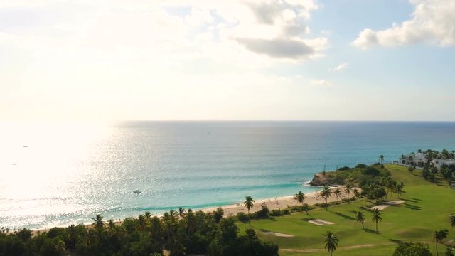 St Maartin Aerial v60 Flying low over golf course and Mullet Bay panning.