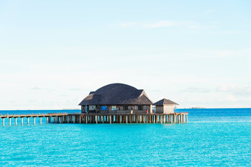 beautiful tropical sea with wood house in blue sky
