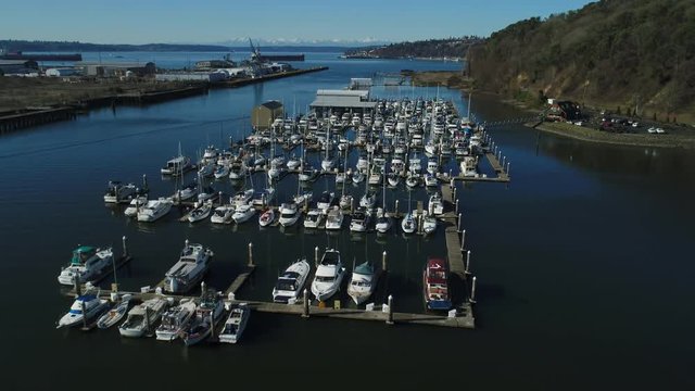 Aerial flyover view of marina and boats docked