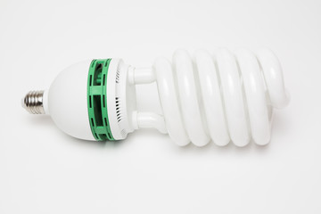 Energy saving fluorescent bulb on white background