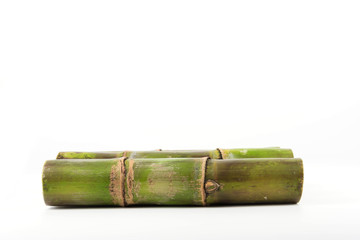 Close up of sugar cane in isolated white background