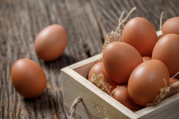 Fresh eggs in wooden box on wooden table, Chicken Egg