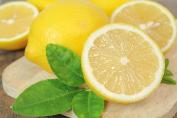 fresh lemon whole and slice with lemon leaf