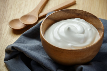 Greek yogurt on wooden background