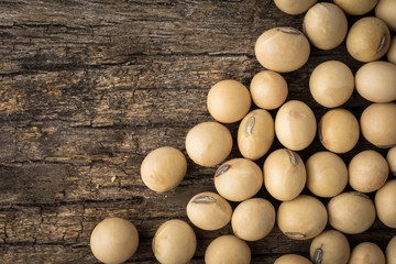 Soy beans on wood background