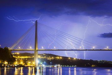 Fototapeta na wymiar Lightning Striking a bridge