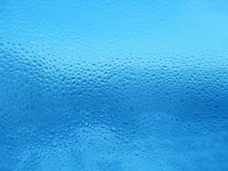 Natural water drops on glass
