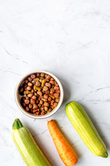 healthy dogfood set with vegetables on white table top view mock-up