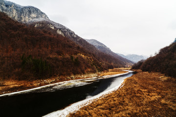 beautiful scenery with a mountain river in winter