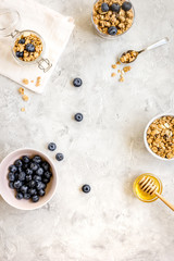 Oat flakes with honey and berries on table background top view