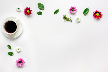 Cup of americano and flowers on white table top view mock-up