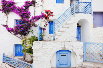 Fototapeta na wymiar Traditional greek house with flowers in Astypalaia island, Dodecanese, Greek islands