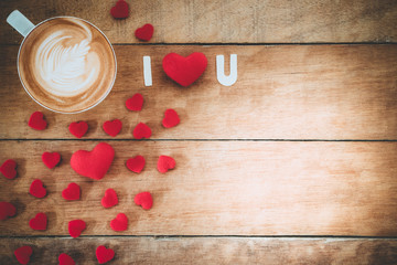 Caption word love, heart and cup of coffee on wooden background with copy space.Valentines Day background concept, Wedding day.Top view vintage tone
