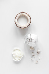 organic cosmetics with coconut on white background top view mockup