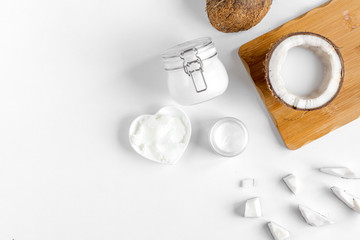 organic cosmetics with coconut on white background top view