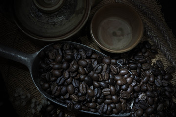 roasted coffee bean purifying from spoon