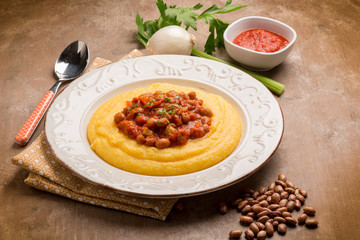porridge with beans and tomatoes sauce