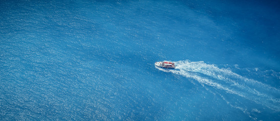 Boat in the blue sea