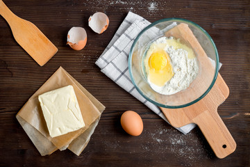 cooking pancake on wooden background top view ingredients for making